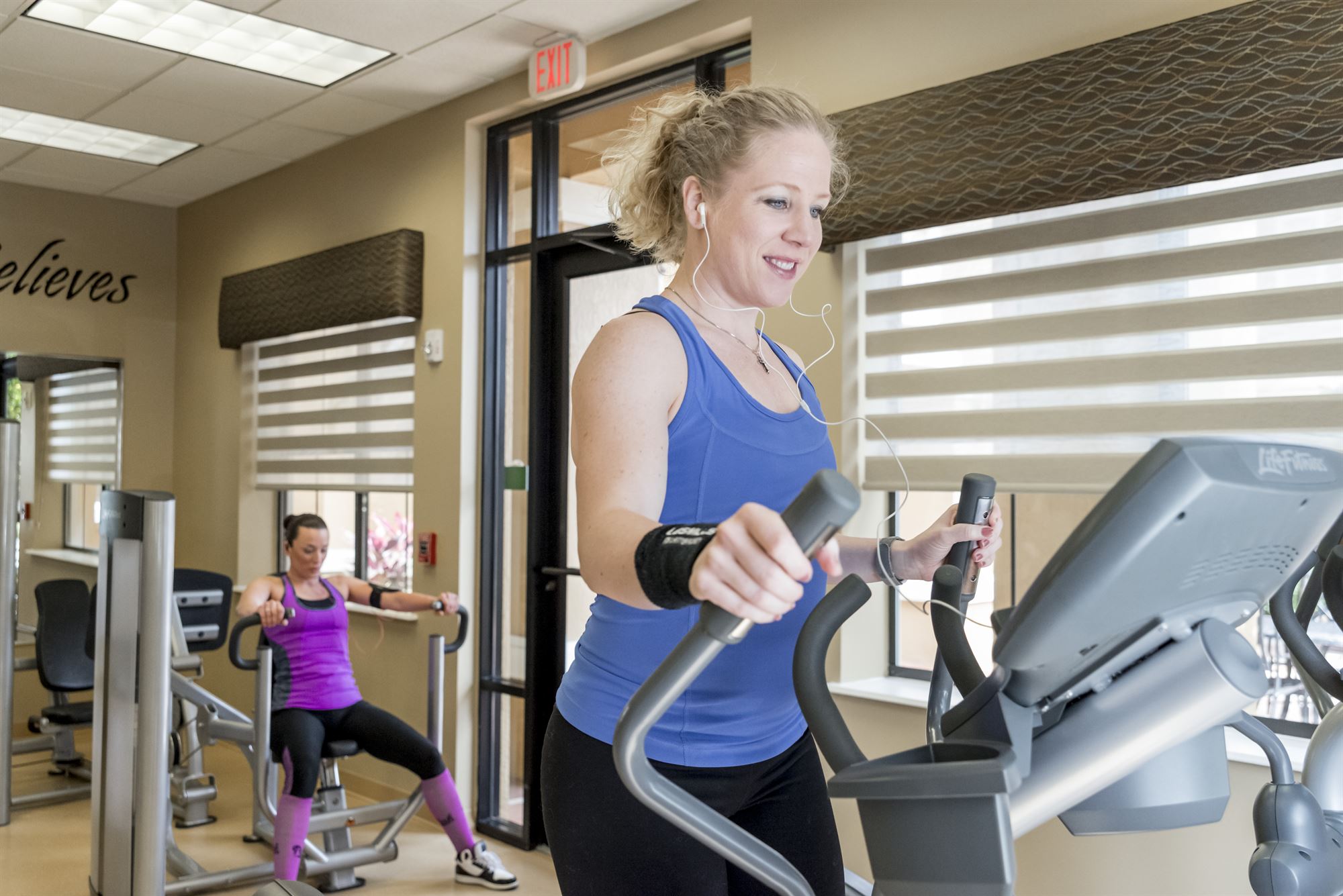 Guest working out at our Orlando resort onsite fitness center