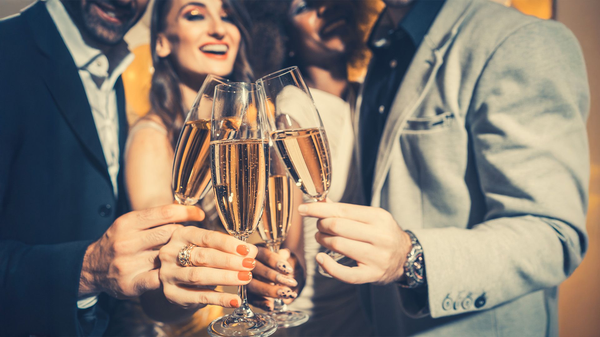 three people having a toast with champagne